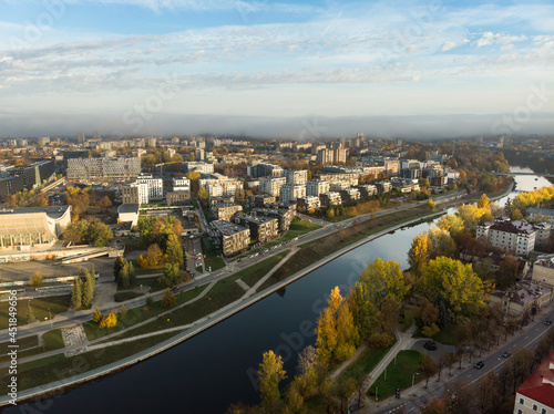 Beautiful Vilnius city panorama in autumn with orange and yellow foliage. Aerial evening view. Fall city scenery in Lithuania © MNStudio