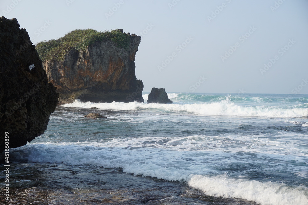 Mesra beach with a natural background. Mesra means intimate. Mesra beach also known as kukup beach or ngrawe beach