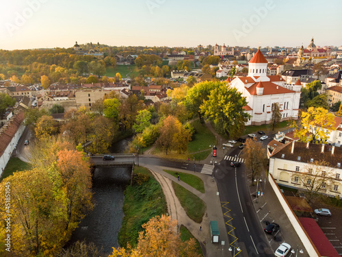 Beautiful Vilnius city panorama in autumn with orange and yellow foliage. Aerial evening view. Fall city scenery in Lithuania