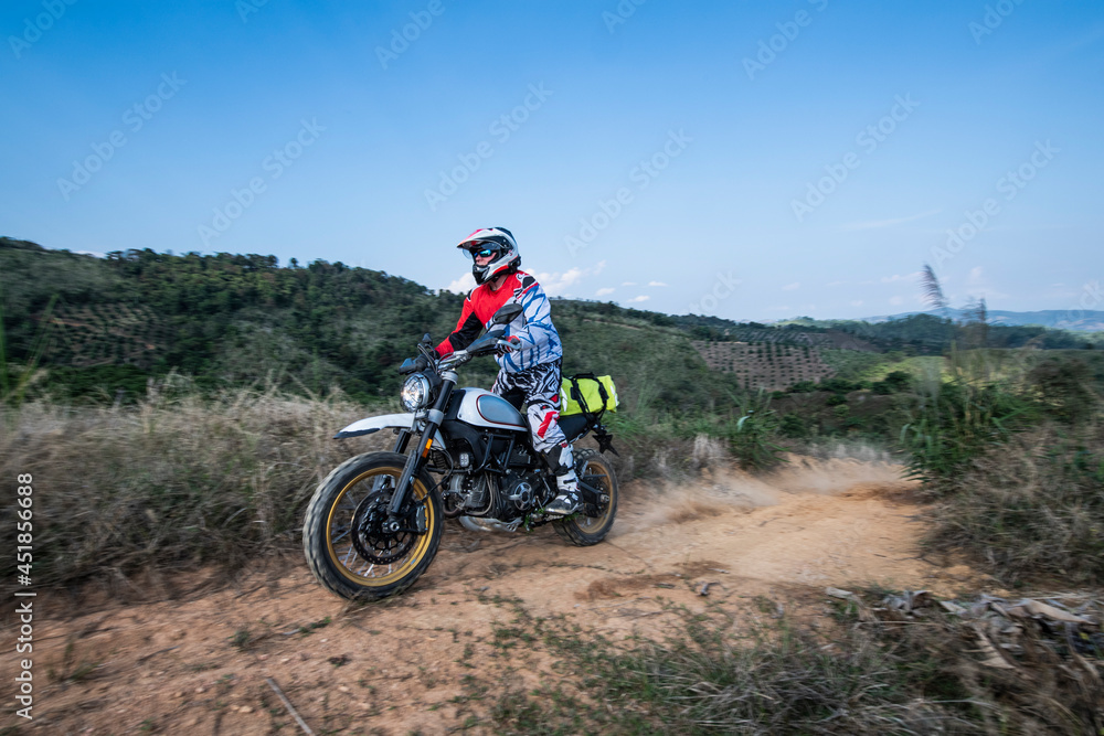 senior adult riding his dirt bike in the hills around Chiang Mai senior adult riding his dirt bike in the hills around Chiang Mai