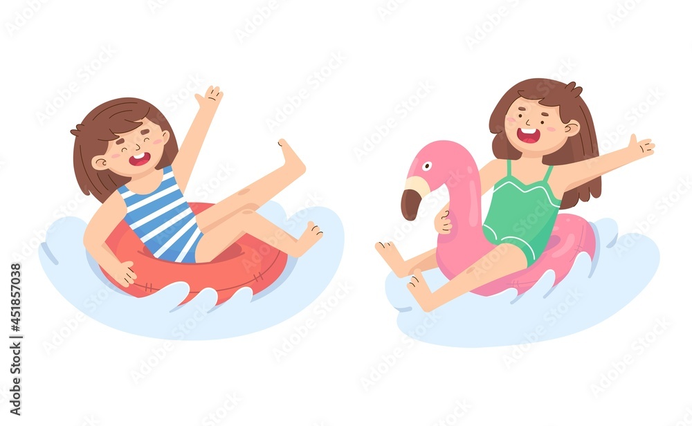 Little girls swim on inflatable circles. Activity at sea Little girls swim on inflatable circles. Activity at sea