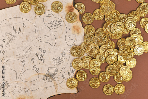 Slika na platnu Hand drawn pirate treasure map with toy gold coins for children