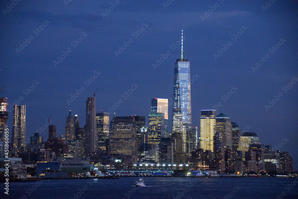 new york city skyline at night showing Freedom Tower at World Trade Center