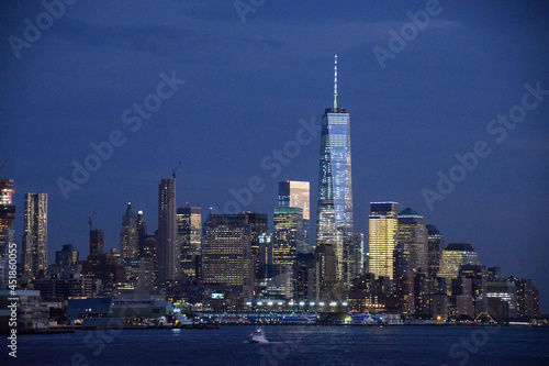 new york city skyline at night showing Freedom Tower at World Trade Center