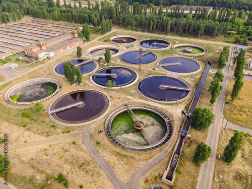 Round wastewater cleaning reservoirs at a sewage treatment facility. Grey water recycling, aerial view