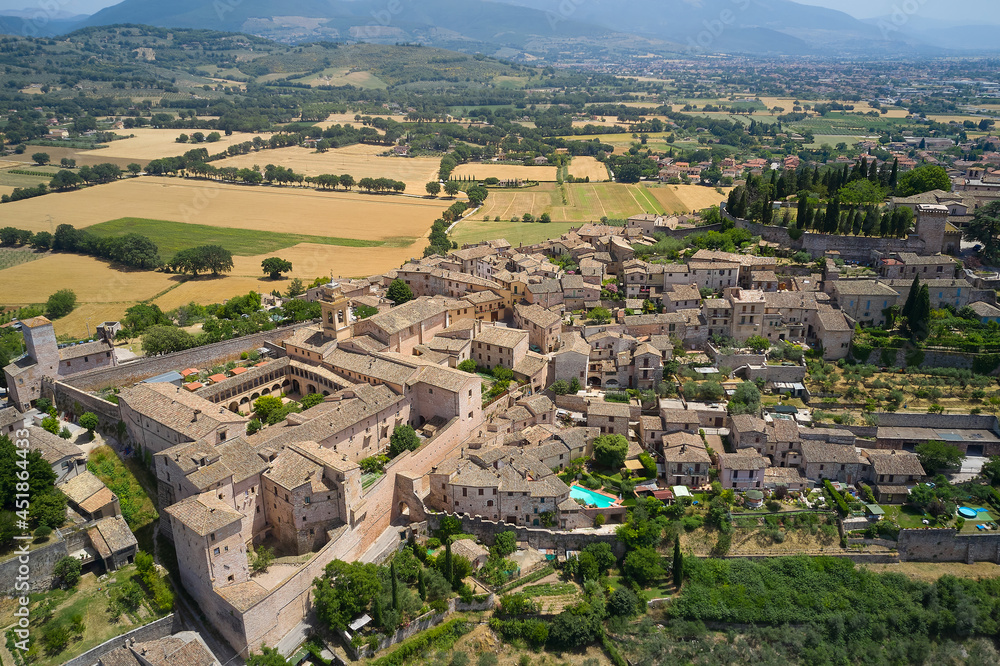 frontal aerial view of the medieval town of spello umbria