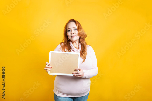 white old business woman showing empty whiteboard