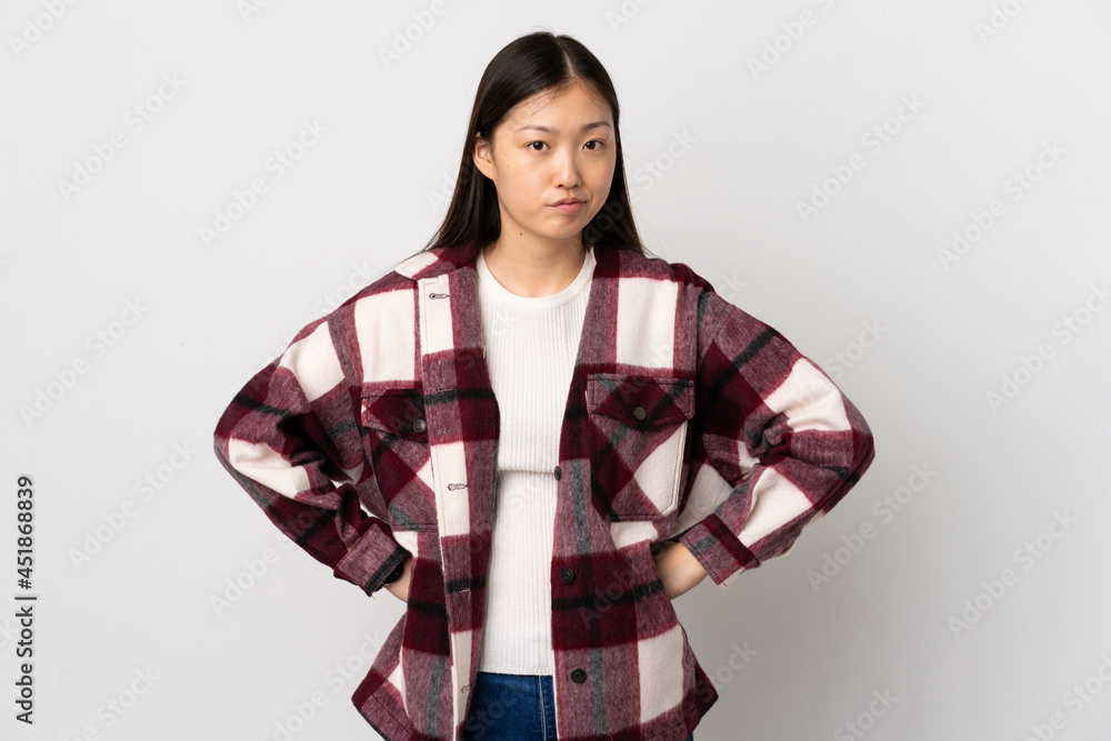Young Chinese girl over isolated white background angry Young Chinese girl over isolated white background angry