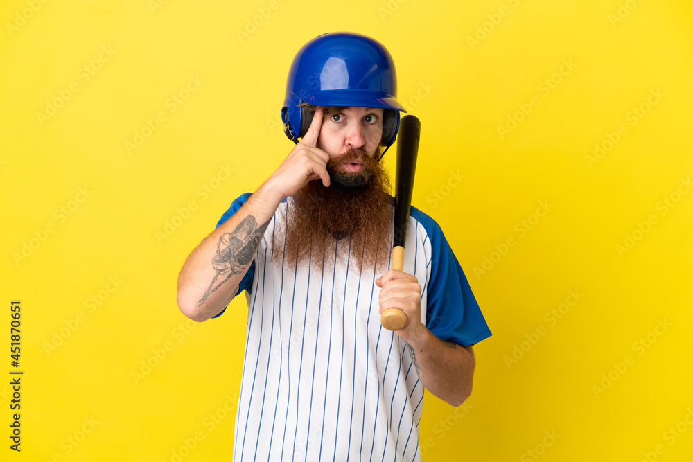 Redhead baseball player man with helmet and bat isolated on yellow background thinking an idea