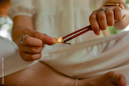 Fotografi Lighting up the  red Incense sticks in  Buddhist temple custom,