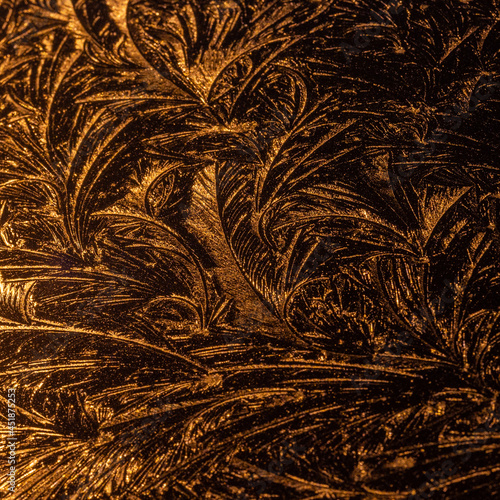 Ice patterns or frost patterns formed on the bodywork of a car during a freezing cold night. Frost ferns, fractal, pattern, abstract