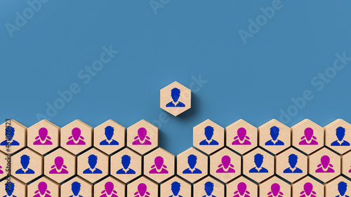 hexagon tile with a person symbol on it is moving up out of many hexagons with people symbols on it on blue background photo