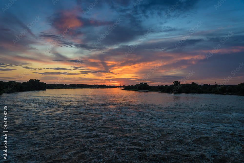 Naklejka premium Sunset on the river Elbe near Hamburg.