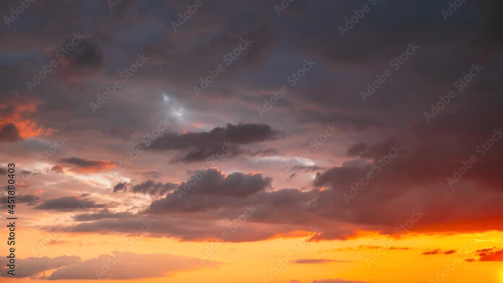 4K Sunset Cloudy Sky With Fluffy Clouds. Sunset Sky Natural Background. Sunrays, sunray, ray, Dramatic Sky. Sunset Time Lapse Time-Lapse In Yellow, Orange, Pink Colors. Day To Evening Transition 4K Sunset Cloudy Sky With Fluffy Clouds. Sunset Sky Natural Background. Sunrays, sunray, ray, Dramatic Sky. Sunset Time Lapse Time-Lapse In Yellow, Orange, Pink Colors. Day To Evening Transition