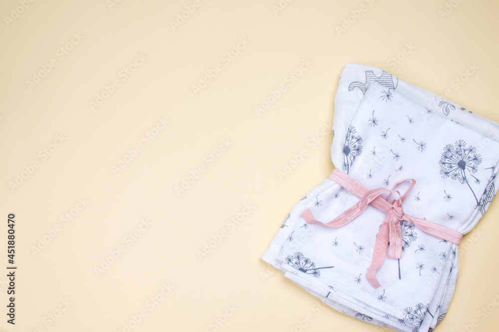 A set of fabric muslin nappies. Eco-friendly cloth diapers for newborns. Baby hygiene concept. A set of fabric muslin nappies. Eco-friendly cloth diapers for newborns. Baby hygiene concept.