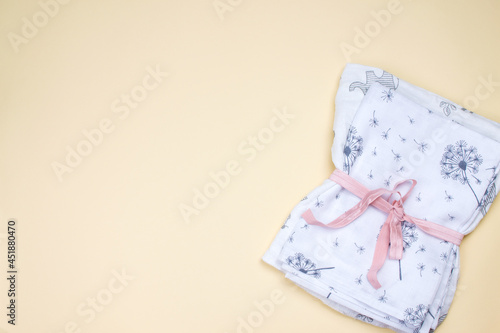 A set of fabric muslin nappies. Eco-friendly cloth diapers for newborns. Baby hygiene concept.