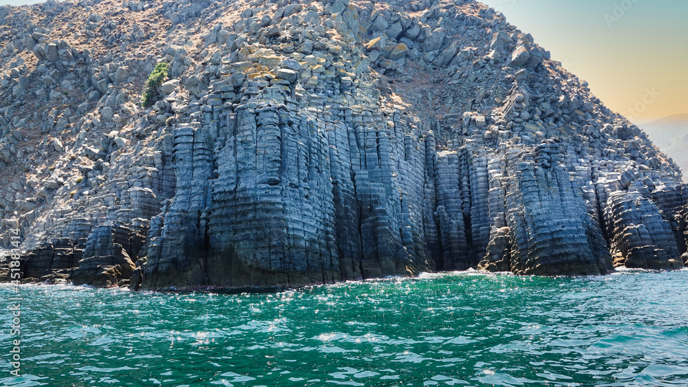 marble stone block cliffs, volcanic mountain in island sea