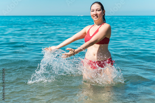 Young Girl Having Fun While Bathing In The Sea © Hector Pertuz