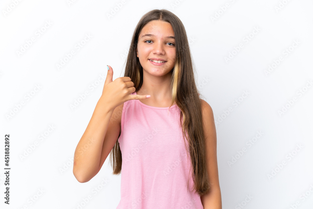 Little caucasian girl isolated on white background making phone gesture. Call me back sign