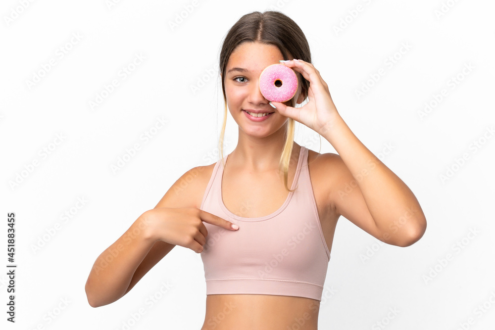 Little caucasian girl isolated on white background holding a donut and happy Little caucasian girl isolated on white background holding a donut and happy