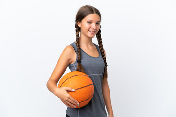 Little caucasian girl isolated on white background playing basketball