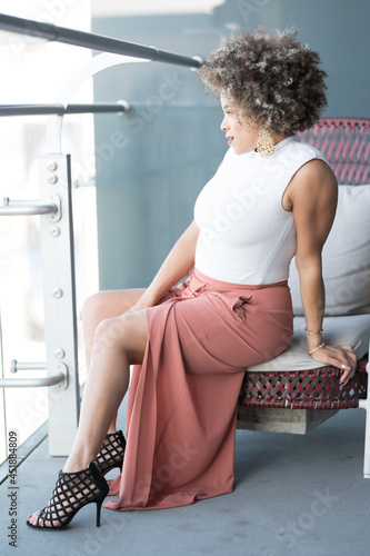 Photography Young African-American Woman Lounging on the Balcony