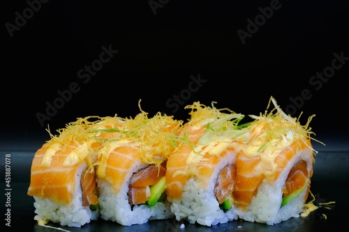 4 pieces of sushi rolls with salmon