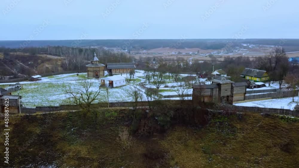 Aerial view of medieval castle mound in belarusian city Mstislavl in winter. Reconstruction of an ancient settlement. Travel concept. Aerial view of medieval castle mound in belarusian city Mstislavl in winter. Reconstruction of an ancient settlement. Travel concept.