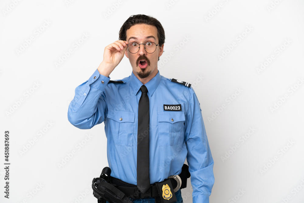 Young police man over isolated background white with glasses and surprised Young police man over isolated background white with glasses and surprised