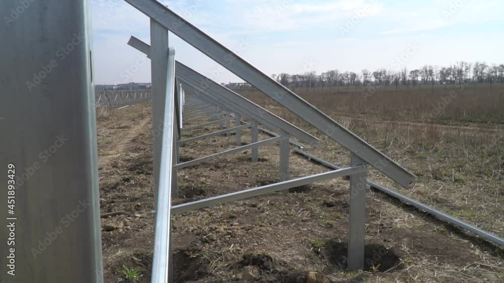 Construction site of a solar power station, empty racks for solar panels Construction site of a solar power station, empty racks for solar panels