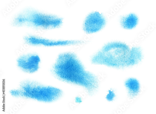 Watercolor spots of blue color. A set of paint blots. Clipart on a white background. A template of picturesque smudges on design paper. Artistic brushstroke on paper. hand drawn illustration