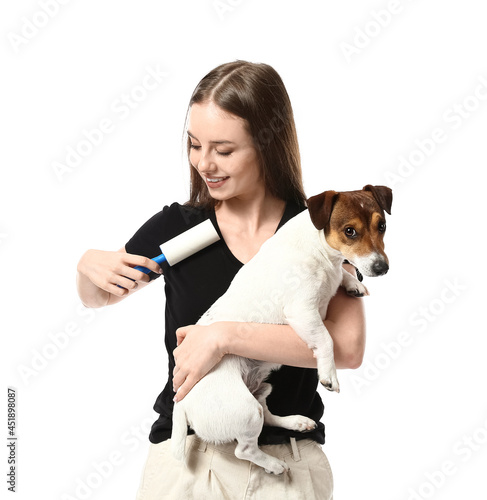 Young woman with lint rolle...