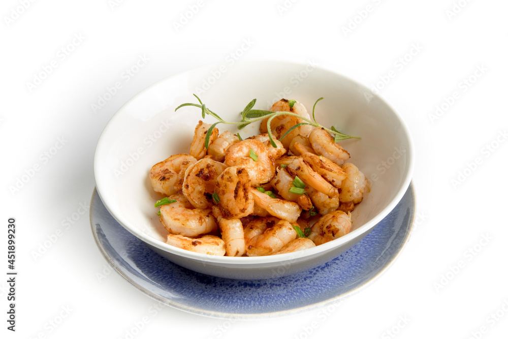 Sauted shrimp in a dish with green onions and basil Sauted shrimp in a dish with green onions and basil