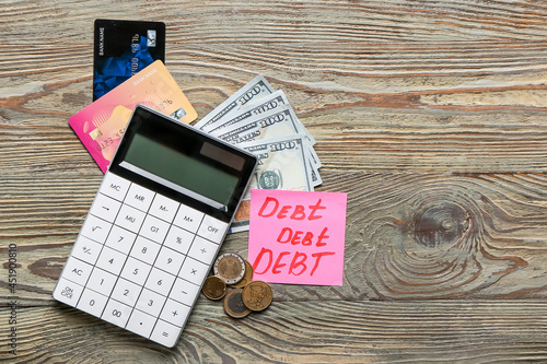 Paper with word DEBT, money...