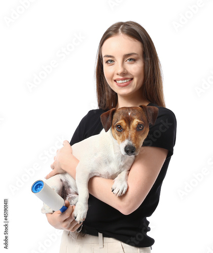 Young woman with lint rolle...