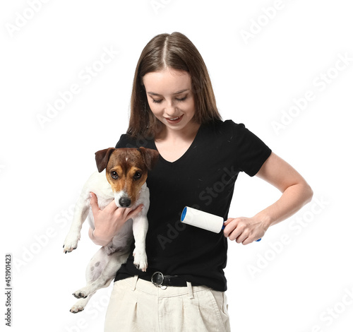 Young woman with lint rolle...