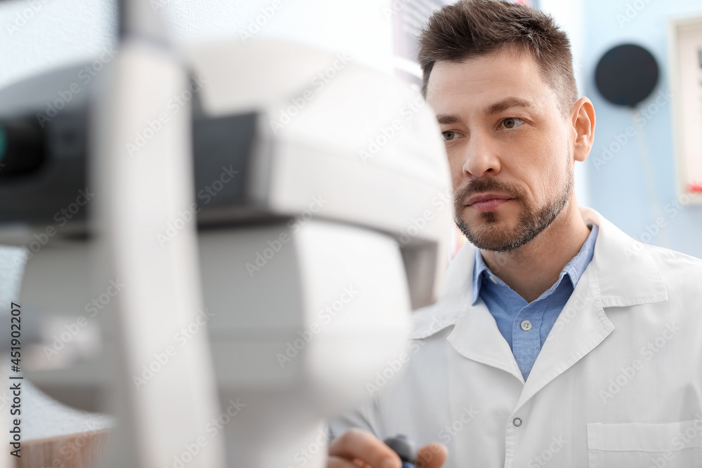 Fototapeta premium Male ophthalmologist working in clinic