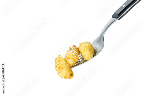 Fork with tasty pesto gnocchi on white background photo