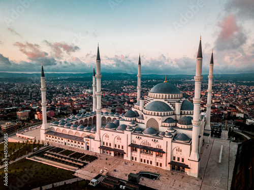 Suleymaniye Mosque surrounded by buildings in the evening in Istanbul, Turkey photo