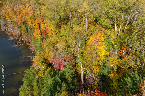 Aerial view of colorful autumn trees near Council lake in Michigan upper peninsula