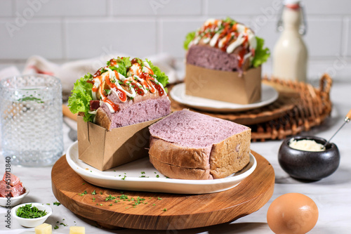 Korean Sandwich Purple Bread (Egg Drop) with Egg, Lettuce, Mayonaise, Sauce. Served with Milk. Homemade Jiwa Toast photo