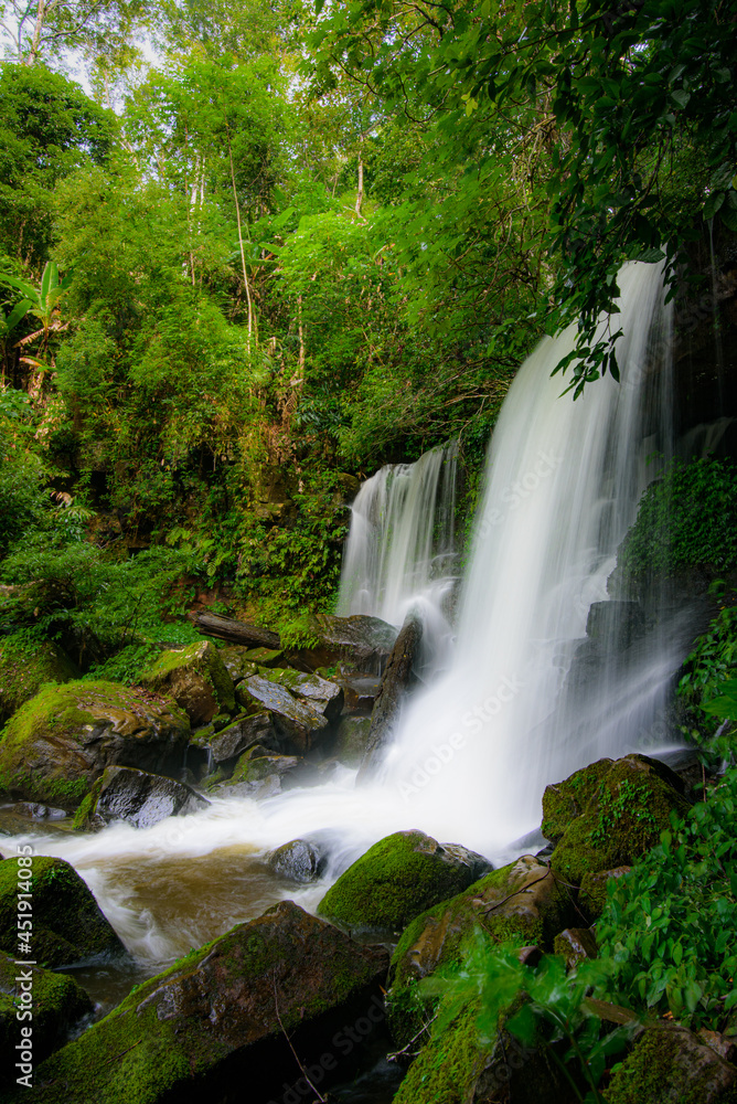 Waterfall rocks with green moss. deep forest at center of the forest in thailand