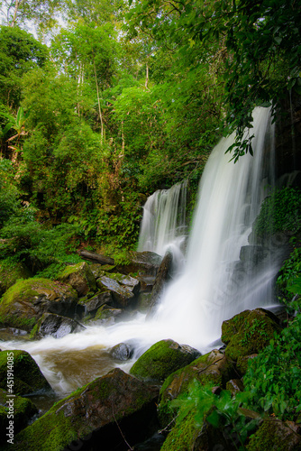 Waterfall rocks with green moss. deep forest at center of the forest in thailand