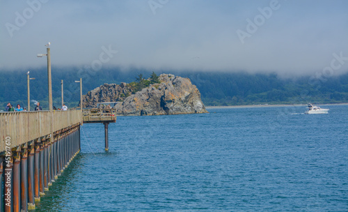 Gorgeous view from Battery Point Beach of the B Street Pier in Crescent City, Del Norte County, California  photo