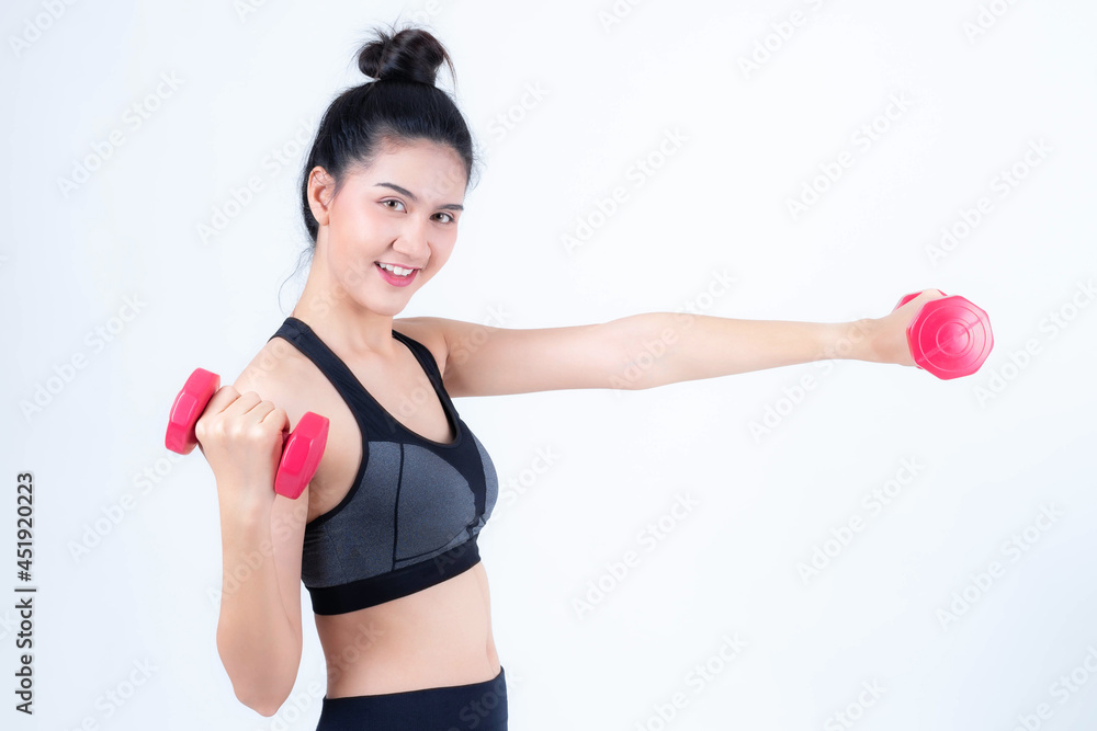 Fitness Asian woman doing working push up with weights dumbbells , Beautiful cute girl beauty sexy woman smile in sportswear exercising - isolated on white background Fitness Asian woman doing working push up with weights dumbbells , Beautiful cute girl beauty sexy woman smile in sportswear exercising - isolated on white background