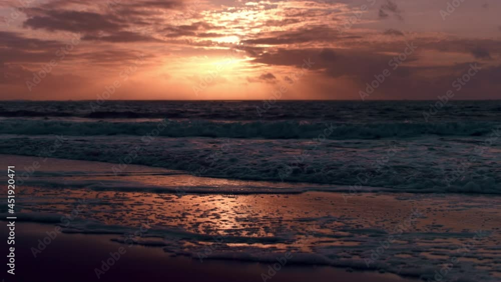 Beautiful Sunrise or Sunset Over Ocean Horizon Along Coastal Beach with Waves. Beautiful Sunrise or Sunset Over Ocean Horizon Along Coastal Beach with Waves.