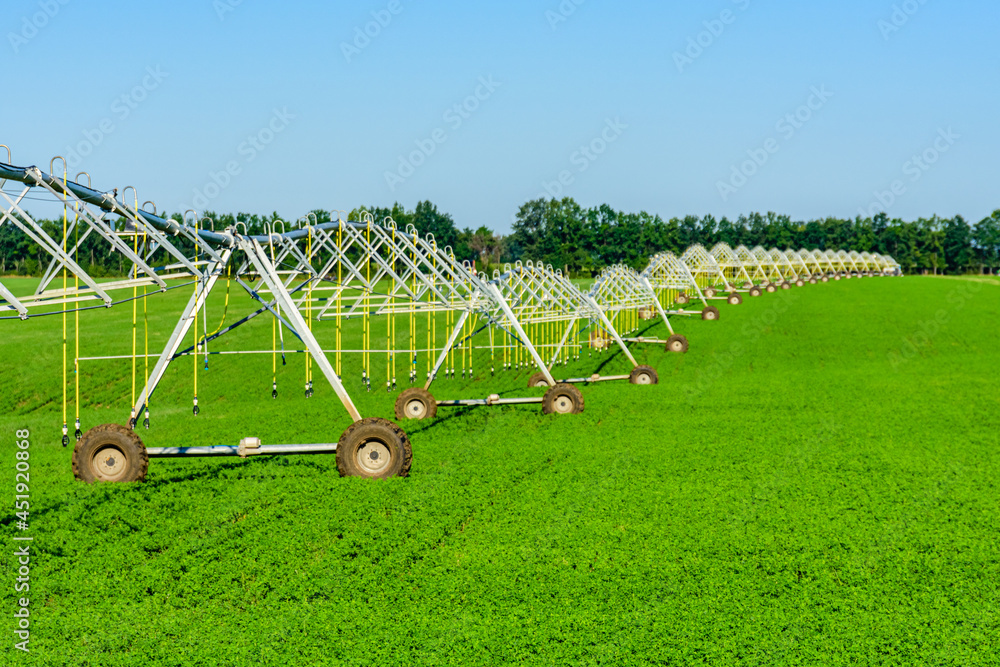 Modern irrigation system at the fertile agricultural field