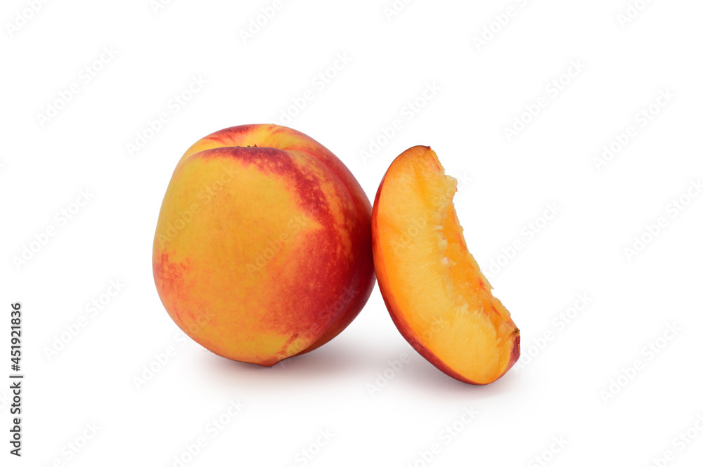 A whole ripe red-yellow nectarine next to a cut wedge. Isolated on white background A whole ripe red-yellow nectarine next to a cut wedge. Isolated on white background