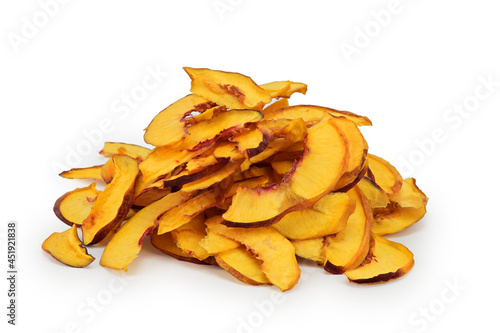 Slice of dried nectarine wedges with light shadow underneath isolated on a white background