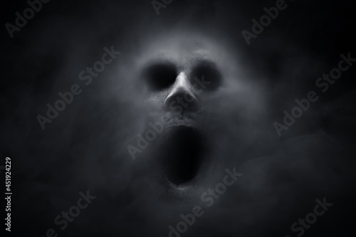 Leinwand Poster Scary ghost on dark background